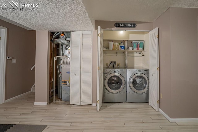 270 Wallace St, Colorado Springs, CO 80911 - washroom with washer and dryer, baseboards, light wood finished floors, and laundry area