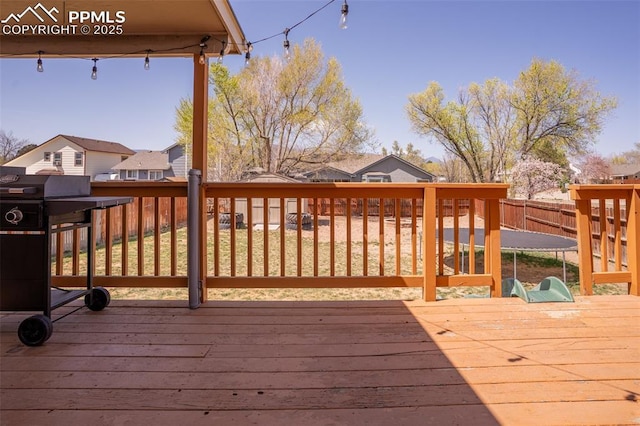 270 Wallace St, Colorado Springs, CO 80911 - deck with a fenced backyard, a residential view, and a trampoline