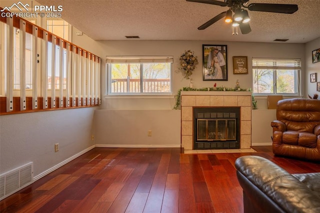 270 Wallace St, Colorado Springs, CO 80911 - living area with wood-type flooring, a ceiling fan, a textured ceiling, and visible vents