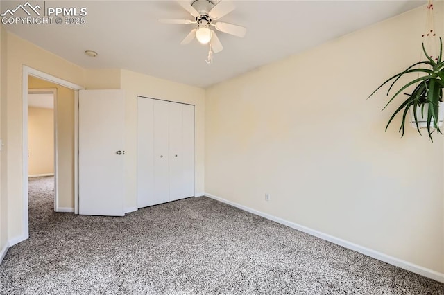 unfurnished bedroom with a closet, carpet flooring, and baseboards