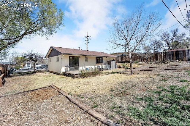 627 E Las Animas St, Colorado Springs, CO 80903 - back of property with fence and stucco siding