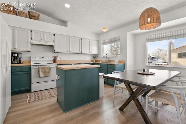 kitchen featuring under cabinet range hood, white appliances, wooden counters, a textured ceiling, and lofted ceiling