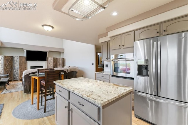 11960 S Conestoga Trl, Elbert, CO 80106 - kitchen featuring appliances with stainless steel finishes, gray cabinetry, light wood-type flooring, and recessed lighting