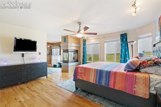 11960 S Conestoga Trl, Elbert, CO 80106 - bedroom featuring wood finished floors and a ceiling fan