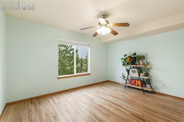 11960 S Conestoga Trl, Elbert, CO 80106 - spare room featuring light wood-style flooring, a ceiling fan, and baseboards