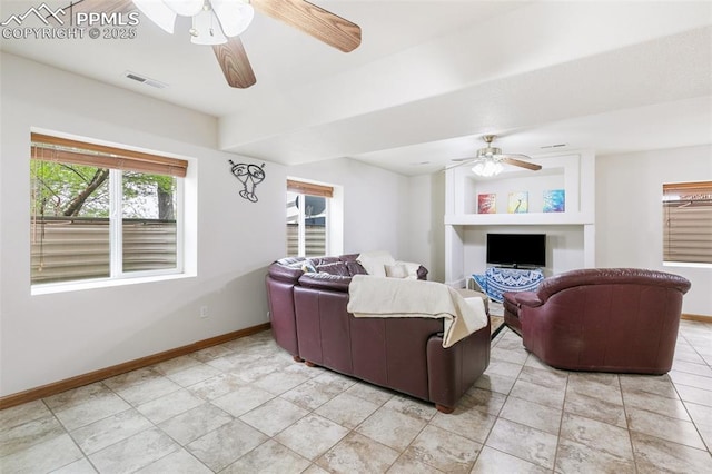 11960 S Conestoga Trl, Elbert, CO 80106 - living room with ceiling fan, baseboards, and light tile patterned flooring