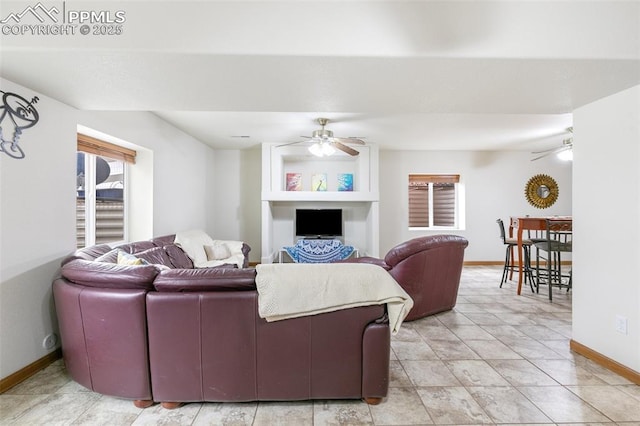 11960 S Conestoga Trl, Elbert, CO 80106 - living area with a ceiling fan and baseboards