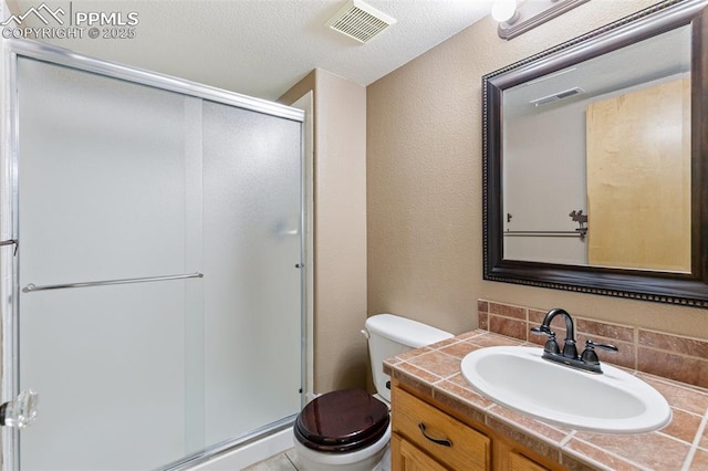 11960 S Conestoga Trl, Elbert, CO 80106 - full bath with toilet, vanity, a stall shower, decorative backsplash, and a textured ceiling