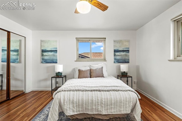 bedroom featuring baseboards, a ceiling fan, and wood finished floors