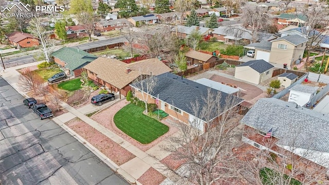 birds eye view of property with a residential view