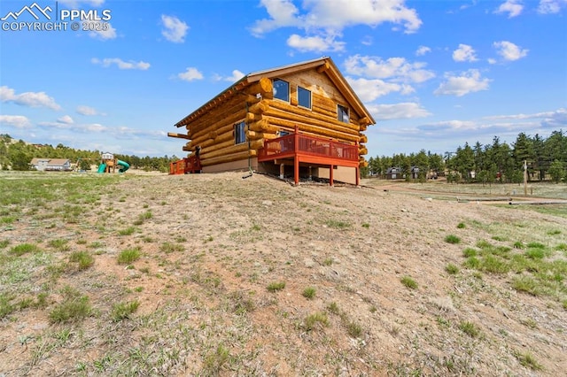 654 High Pasture Rd, Florissant, CO 80816 - rear view of property with log siding and a wooden deck