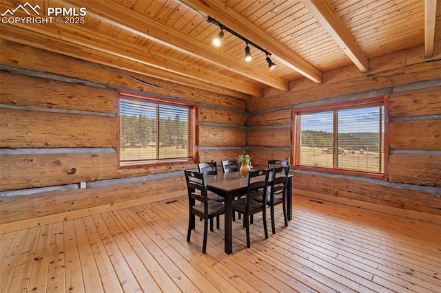 654 High Pasture Rd, Florissant, CO 80816 - dining space with track lighting, wooden ceiling, plenty of natural light, hardwood / wood-style flooring, and beamed ceiling