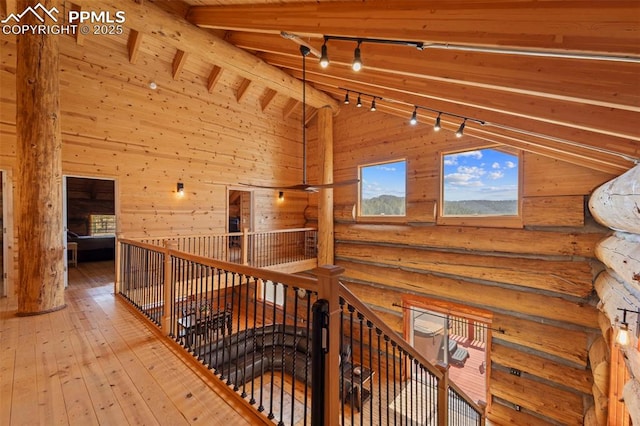 654 High Pasture Rd, Florissant, CO 80816 - hall with rail lighting, high vaulted ceiling, wooden ceiling, wood-type flooring, and beamed ceiling