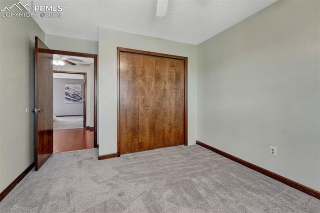 carpeted bedroom with a ceiling fan, baseboards, and a closet