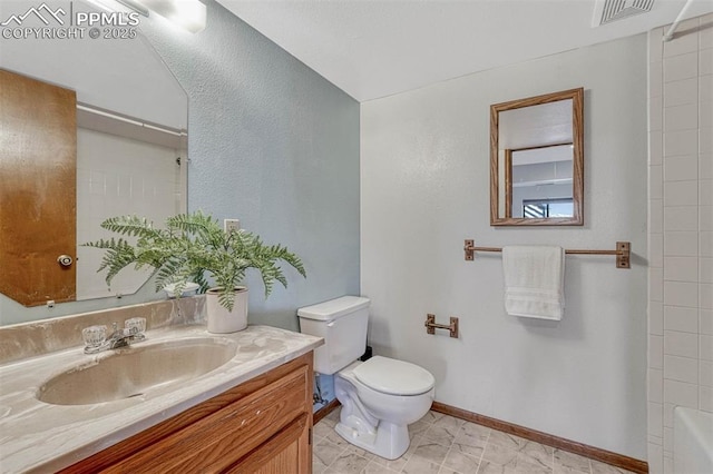 full bath with a washtub, vanity, baseboards, toilet, and visible vents