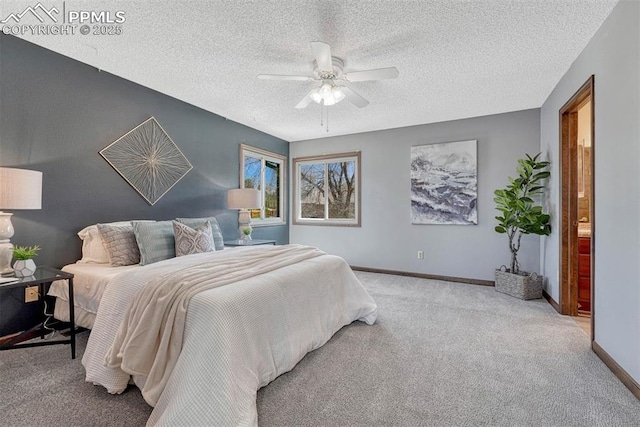 carpeted bedroom featuring a textured ceiling, a ceiling fan, and baseboards