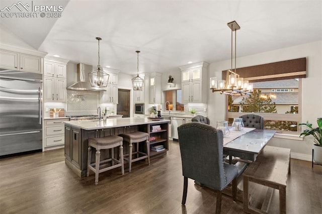 4043 Needles Dr, Colorado Springs, CO 80908 - dining room with recessed lighting, baseboards, an inviting chandelier, and dark wood finished floors
