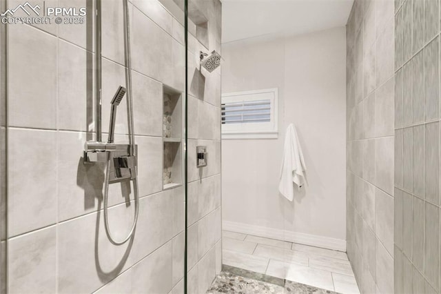 4043 Needles Dr, Colorado Springs, CO 80908 - bathroom with baseboards and tiled shower