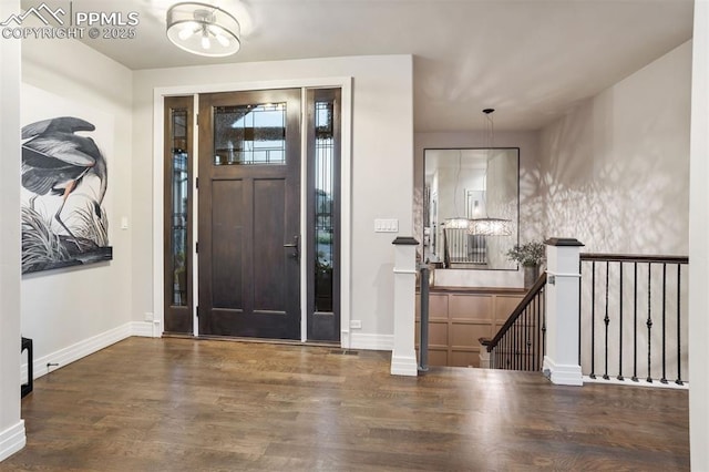 4043 Needles Dr, Colorado Springs, CO 80908 - entryway featuring baseboards, wood finished floors, and a notable chandelier