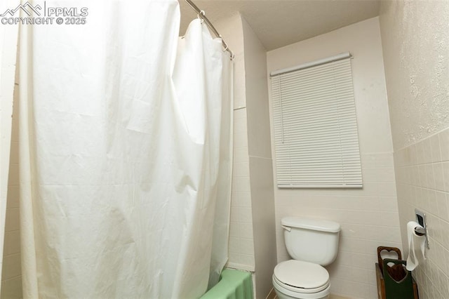 710 S Royer St, Colorado Springs, CO 80903 - bathroom with shower / bath combination with curtain, toilet, and tile walls