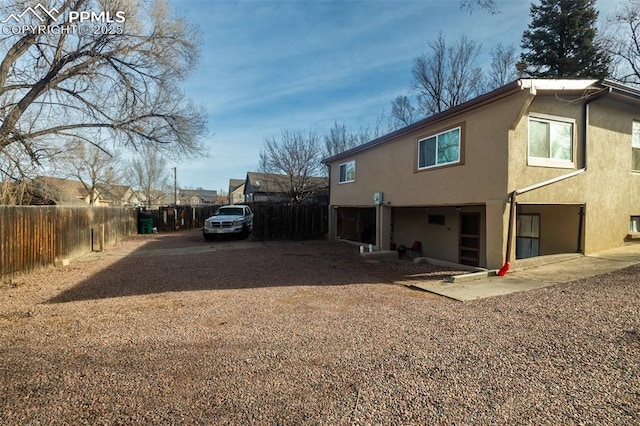 710 S Royer St, Colorado Springs, CO 80903 - view of home's exterior with stucco siding and fence