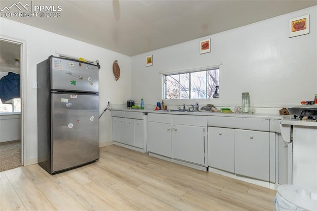 710 S Royer St, Colorado Springs, CO 80903 - kitchen featuring plenty of natural light, light countertops, and freestanding refrigerator