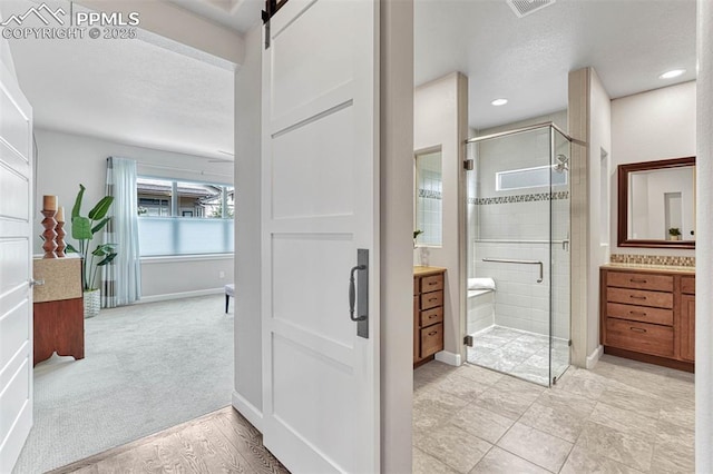 4464 Portillo Pl, Colorado Springs, CO 80924 - full bath featuring a textured ceiling, vanity, a shower stall, and baseboards