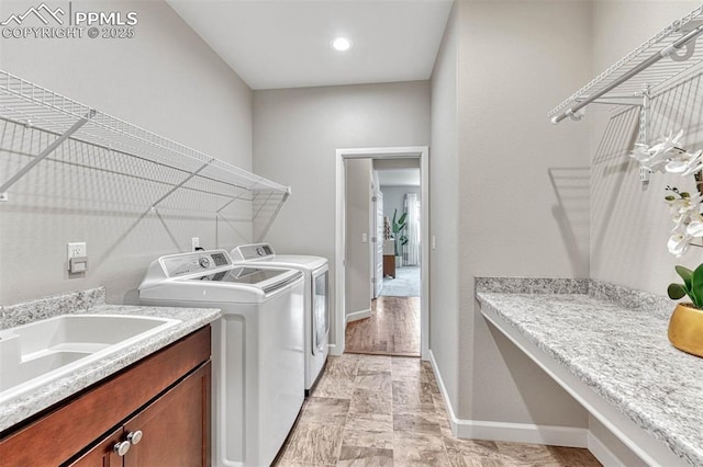 4464 Portillo Pl, Colorado Springs, CO 80924 - washroom with a sink, independent washer and dryer, laundry area, and baseboards