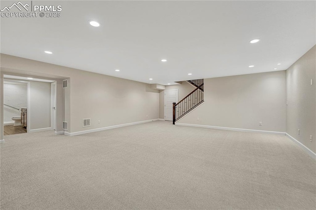 4464 Portillo Pl, Colorado Springs, CO 80924 - finished basement featuring baseboards, stairway, and light colored carpet