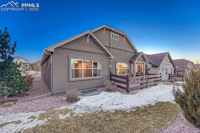 4464 Portillo Pl, Colorado Springs, CO 80924 - snow covered back of property with stucco siding and a wooden deck