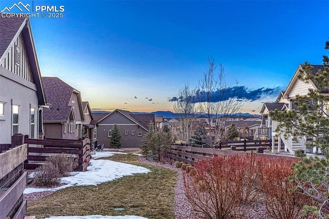 4464 Portillo Pl, Colorado Springs, CO 80924 - yard at dusk with fence and a residential view