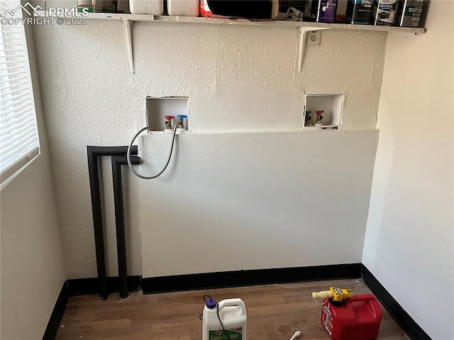 720 E Hills Rd, Colorado Springs, CO 80909 - clothes washing area featuring baseboards, wood finished floors, and hookup for a washing machine