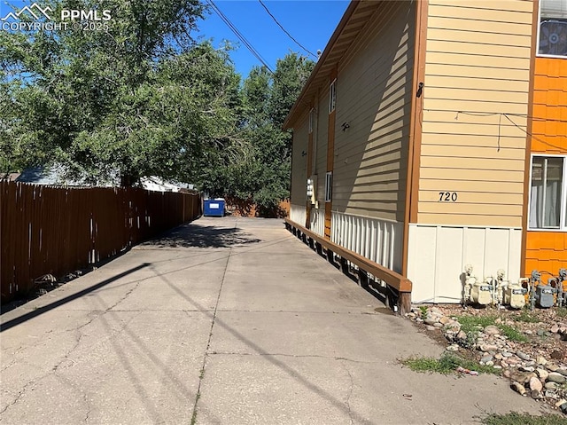 720 E Hills Rd, Colorado Springs, CO 80909 - view of property exterior with fence and driveway
