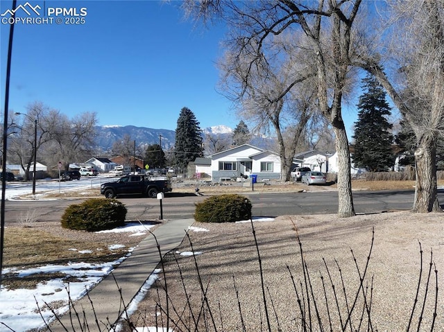 1007 Iowa Ave, Colorado Springs, CO 80909 - view of yard featuring a mountain view and a residential view