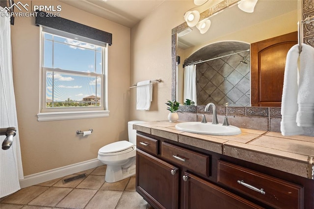full bathroom with tile patterned floors, toilet, baseboards, vanity, and a shower with curtain