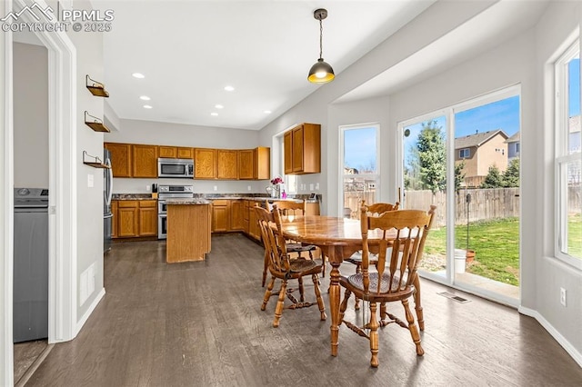 2261 Springside Dr, Colorado Springs, CO 80951 - dining area with a healthy amount of sunlight, baseboards, recessed lighting, and dark wood-style floors