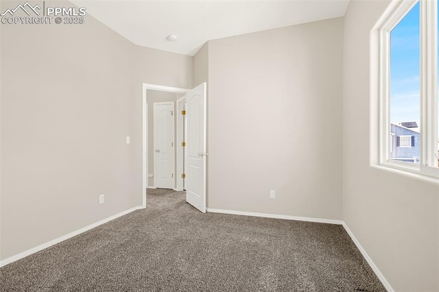 2261 Springside Dr, Colorado Springs, CO 80951 - spare room featuring baseboards and carpet flooring