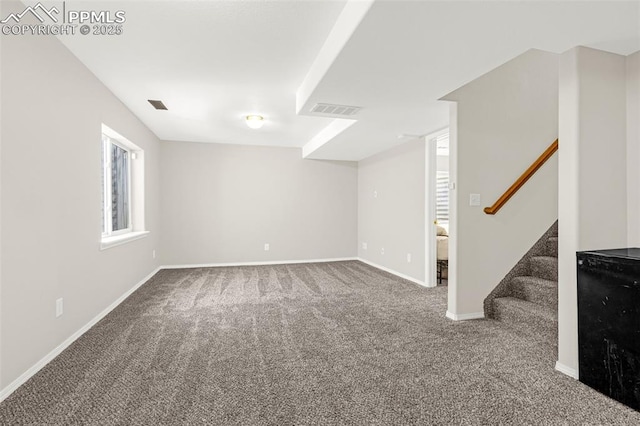 2261 Springside Dr, Colorado Springs, CO 80951 - below grade area featuring visible vents, baseboards, carpet, and stairs