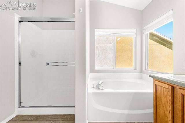 2261 Springside Dr, Colorado Springs, CO 80951 - bathroom with vanity, a bath, and a shower stall