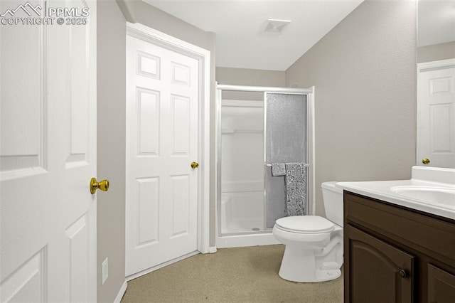 2261 Springside Dr, Colorado Springs, CO 80951 - bathroom with vanity, a stall shower, visible vents, and toilet