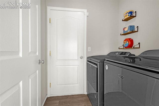 2261 Springside Dr, Colorado Springs, CO 80951 - laundry area featuring baseboards, laundry area, dark wood-type flooring, and washer and dryer