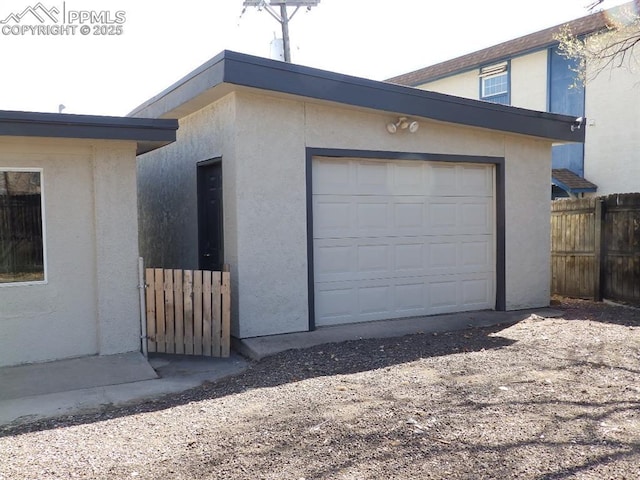 garage with fence