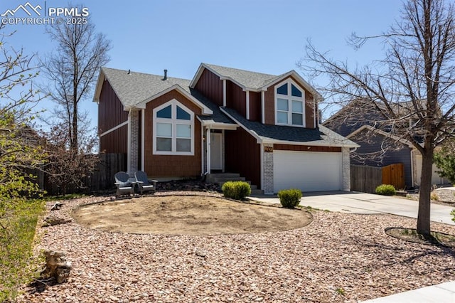 view of front of house featuring fence, an attached garage, driveway, and roof with shingles