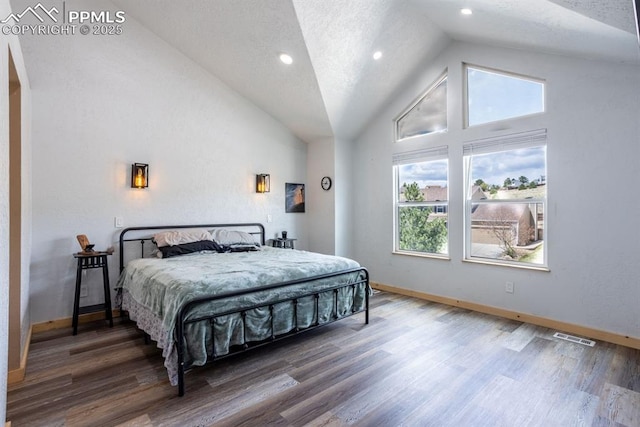bedroom with baseboards and multiple windows
