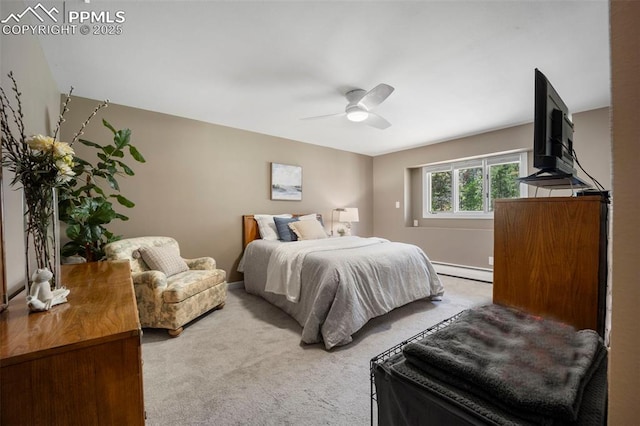 bedroom with carpet floors, a baseboard radiator, baseboards, and a ceiling fan