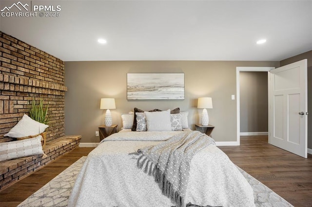 bedroom featuring baseboards, recessed lighting, and wood finished floors