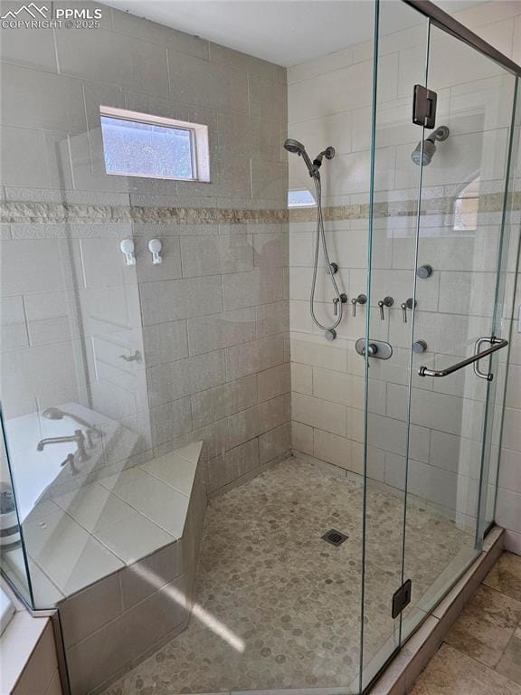 full bathroom featuring a stall shower
