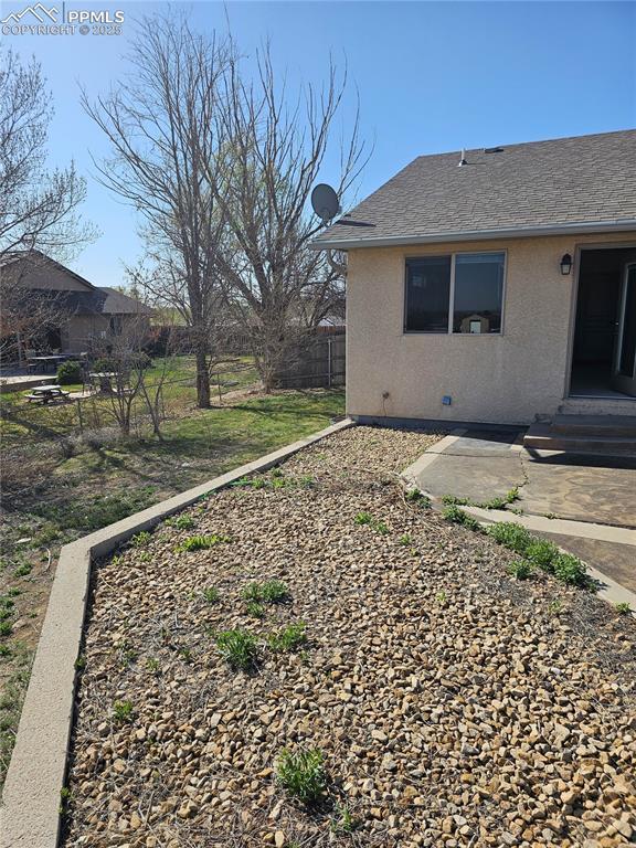 view of yard with fence and a patio area