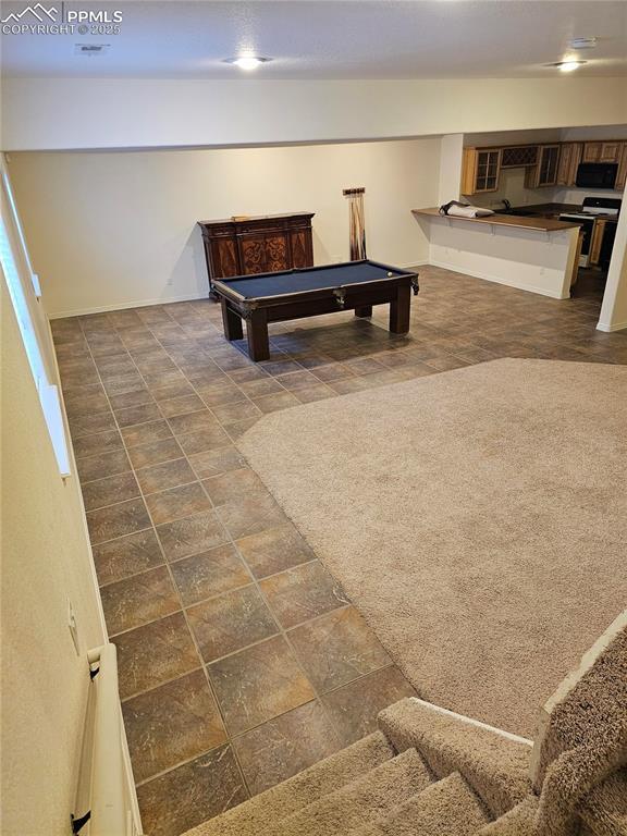 recreation room with pool table and baseboards