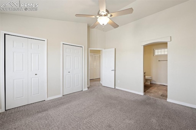 4336 Adam Mark Pt, Colorado Springs, CO 80917 - unfurnished bedroom with carpet flooring, ensuite bath, multiple closets, a ceiling fan, and baseboards